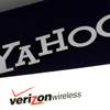 This Monday, July 25, 2016, file photo shows the Yahoo and Verizon logos on a laptop, in North Andover, Mass.