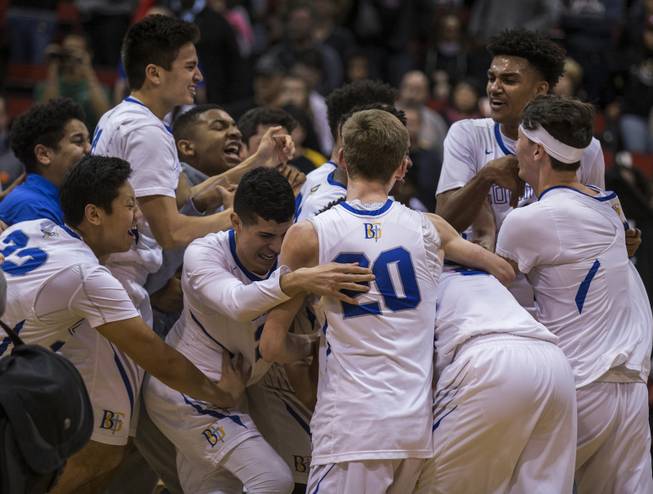 Bishop Gorman players celebrate their win over Clark during their state 4A high school championship game at the Cox Pavilion on Friday, February 24, 2017.