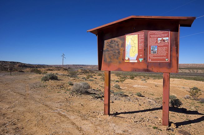 A sign on New Gold Butte Road gives information on ...