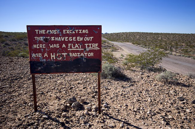 A sign is shown on New Gold Butte Road on ...
