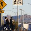 Pedestrians cross Boulder Highway in a designated crosswalk Thursday, March 2, 2017.
