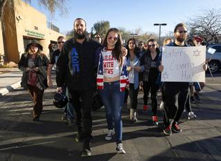 Gil Hayon, president of UNLV'S Alpha Epsilon Pi fraternity, and Elizabeth Pelkowski lead a march from the Jewish Federation of Las Vegas to UNLV Monday, March 6, 2017. Alex Reininger holds a right at right. About 200 students and supporters marched to protest recent acts of anti-Semitism in Las Vegas and across the United States.