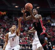 San Diego State guard Trey Kell (3) is late on the defense as UNLV guard Kris Clyburn (1) moves in for a lay up during the Mountain West Basketball Tournament at the Thomas & Mack Center on Wednesday, March 8, 2017.