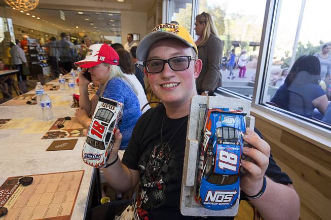 Hunter Frey, 17, displays #18 Diecast cars as he waits for NASCAR driver Kyle Busch in the tasting room at the Ethel M Chocolates factory in Henderson Thursday, March 9, 2017.