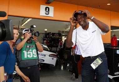 NBA Hall of Famer Dikembe Mutombo, right, laughs in an interview outside the Kevin Harvick’s garage during qualifying for the Monster Energy NASCAR Cup Series auto race Friday, March 10, 2017, in Las Vegas. Mutombo and Harvick recently appeared in a commercial together for Mobil 1 Annual Protection.