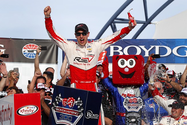 Joey Logano celebrates in victory lane after winning the Boyd ...