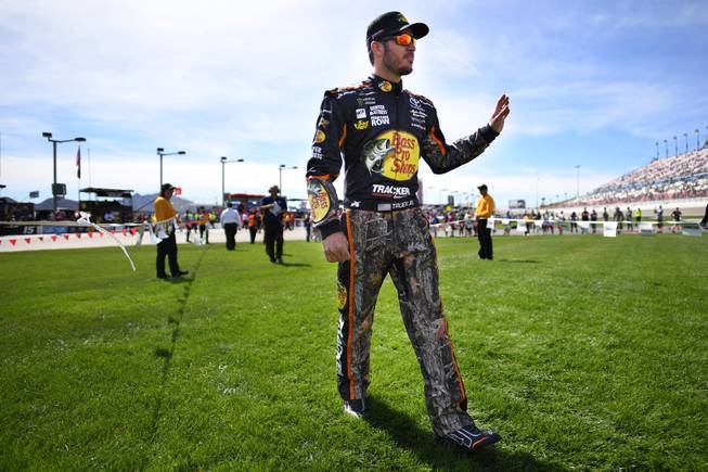 Eventual race winner Martin Truex Jr. makes his way across the infield for driver introductions during the Monster Energy NASCAR Cup Series Kobalt 400 Sunday, March 12, 2017, at the Las Vegas Motor Speedway.