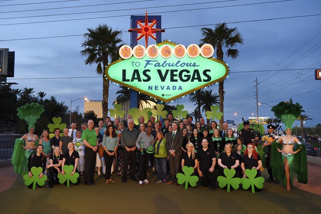 Local officials, business people, showgirls, pipers and Irish dancers pose ...