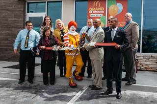 Members celebrate and cut a ribbon during a grand reopening debuting new technology at the McDonald's located at 6480 S. Durango Dr. in Las Vegas, Nev. on March 22, 2017.