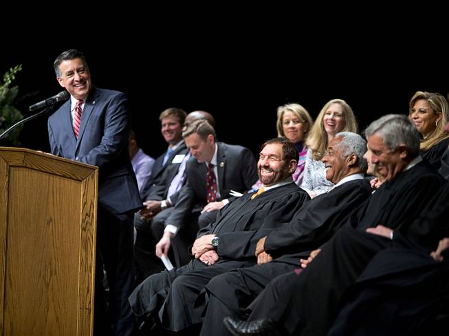 Nevada Governor Brian Sandoval speaks to Supreme Court justices during a grand opening ceremony for the Nevada Supreme Court and Nevada Court of Appeals courthouse in downtown Las Vegas Monday, March 27, 2017.