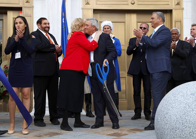 Las Vegas Mayor Carolyn Goodman and Justice James Hardesty hug after cutting a ribbon during a grand opening ceremony for the Nevada Supreme Court and Nevada Court of Appeals courthouse in downtown Las Vegas Monday, March 27, 2017.