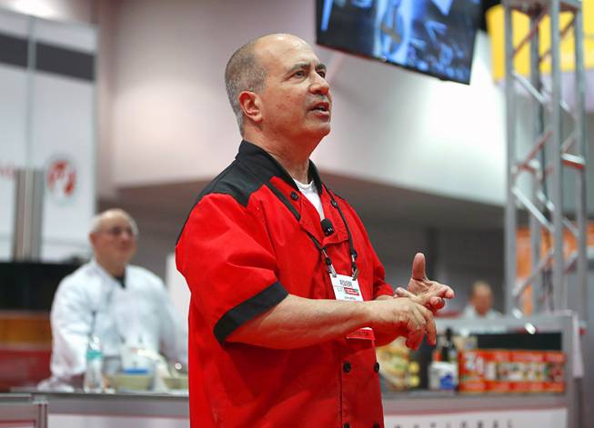 Metro Pizza co-owner John Arena gives a bread baking demonstration with baker and author Peter Reinhart during the International Pizza Expo at the Las Vegas Convention Center Tuesday, March 28, 2017.