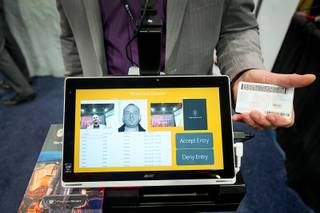 Trevor Thomas of PatronScan demonstrates an ID scanning kiosk during the Nightclub & Bar Convention and Trade Show at the Las Vegas Convention Center Tuesday, March 28, 2017. The system can spot fake IDs, alert to double scans, and identify banned patrons.