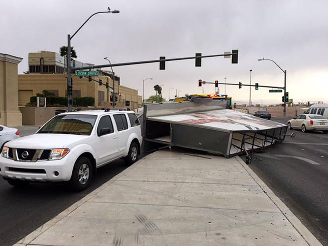 A mobile billboard trailer was toppled by strong winds between Luxor and Mandalay Bay, Thursday, March 30, 2017. 