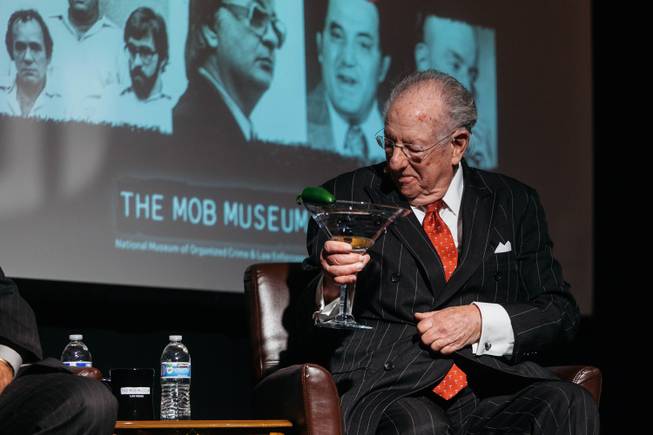 Former Las Vegas Mayor Oscar Goodman holds a martini at the start of a panel discussion called The Media and The Mob held at the Mob Museum on April 4, 2017.