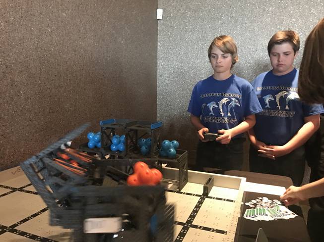 Jason Elliott (holding the control) and Greenspun Junior High Schoo teammates demonstrate robotics recently in Henderson. The team is hoping to go to the VEX Robotics Competition world championships this month in Louisville, Ky.
