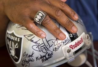 Former Raider Frank Hawkins displays his Super Bowl ring in his office Monday, April 10, 2017. Hawkins, a Las Vegas native and former Las Vegas city councilman, played seven season with the Raiders from 1981-1987.
