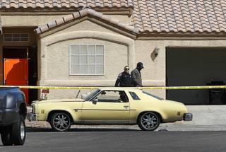 A North Las Vegas police leave a home on Dilly Circle as police investigate a fatal shooting at the home in North Las Vegas Monday, April 10, 2017.