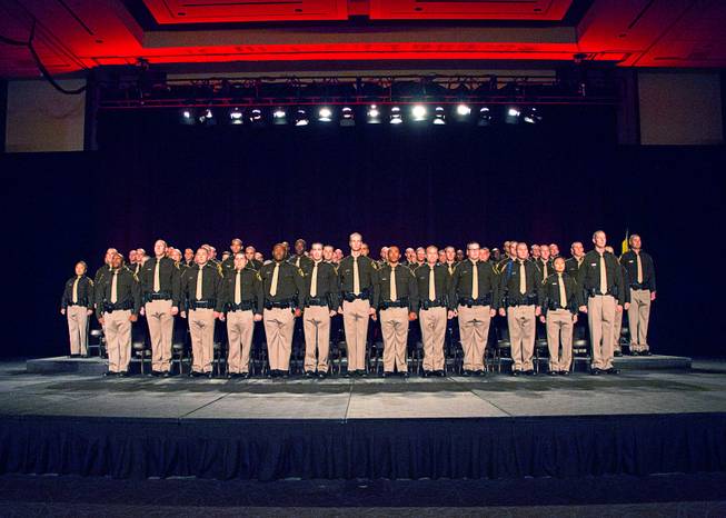 Las Vegas Metro Police recruits arrive onstage for a graduation ceremony at Red Rock Resort Thursday April 13, 2017.  Seventy recruits graduated the academy.