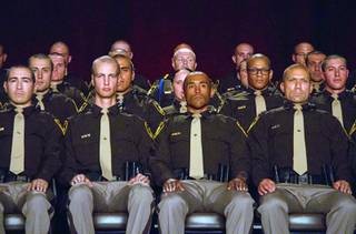 Las Vegas Metro Police recruits listen to speakers during a graduation ceremony at Red Rock Resort Thursday April 13, 2017.  Seventy recruits graduated the academy.