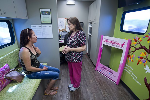 Anabel Prieto, left, gives some medical history to Lynn DeJesus  before her mammogram in the Nevada Health Centers Mammovan Wednesday, April 19, 2017.