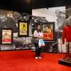 In this April 23, 2015, photo, a woman tours an Elvis exhibition on the first day of "Graceland Presents Elvis: The Exhibition, The Show, The Experience" at Westgate Las Vegas. Hundreds of Elvis Presley artifacts and memorabilia are still being held by the casino, a year after the King's estate filed a lawsuit to get those valuables back.