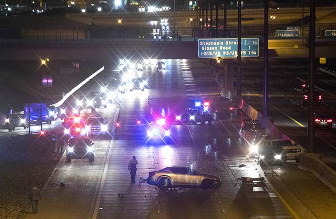 The westbound lanes of I-215 are shut down after an ...