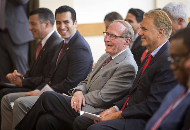 Former Sen. Richard Bryan (D-Nev) laughs during a ceremony honoring former Senate Majority Leader Harry Reid (D-Nev) at UNLV Thursday, April 20, 2017. Reid was officially named as the first Distinguished Fellow in Law and Policy at UNLV's Boyd School of Law. Seated with Bryan from left are: Nevada Gov. Brian Sandoval, Congressman Ruben Kihuen (D-Nev) , and former Sen. John Ensign (R-Nev).