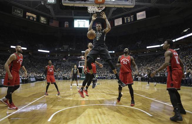 Milwaukee Bucks' Giannis Antetokounmpo dunks during the second half of game 3 of their NBA first-round playoff series basketball game against the Toronto Raptors Thursday, April 20, 2017, in Milwaukee.