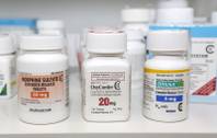 In this Jan. 18, 2013, file photo: Morphine Sulfate, OxyContin and Opana are displayed.