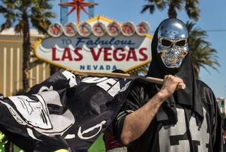 Oakland Raiders fan Sebastian Bodden is all geared up and ready to hear their third-day draft picks announced from the Welcome to Las Vegas sign complete with Gov. Brian Sandoval and others on Saturday, April 29, 2017.
