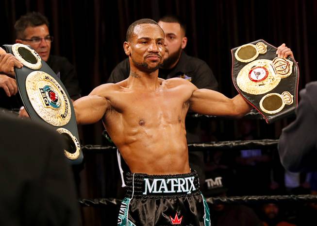Featherweight boxer Claudio Marrero of the Dominican Republic poses witht title belts after defeating Carlos Zambrano of Peru in a featherweight title fight at Sam's Town Saturday, April 29, 2017. Marrero took the interim WBA title from Zambrano with a first round knockout.