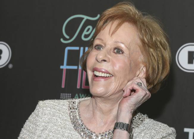 In this March 10, 2016, file photo, Texas Film Hall of Fame honoree Carol Burnett tugs on her ear at the 2016 Texas Film Awards at Austin Studios in Austin, Texas.