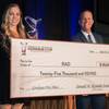 Lt. Gov. Mark Hutchison congratulates UNLV's Rachel Farner, a member of the student team behind the Resilient Arthroplasty Device which won first place in a recent stateside business plan competition in Reno.