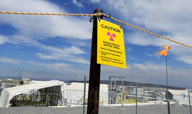 In this July 9, 2014, file photo, a sign warns of radioactivity on the Hanford Nuclear Reservation near Richland, Wash. 