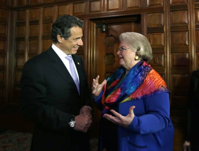 New York Gov. Andrew Cuomo talks with Weddington after a news conference at the Capitol on June 4, 2013, in Albany.