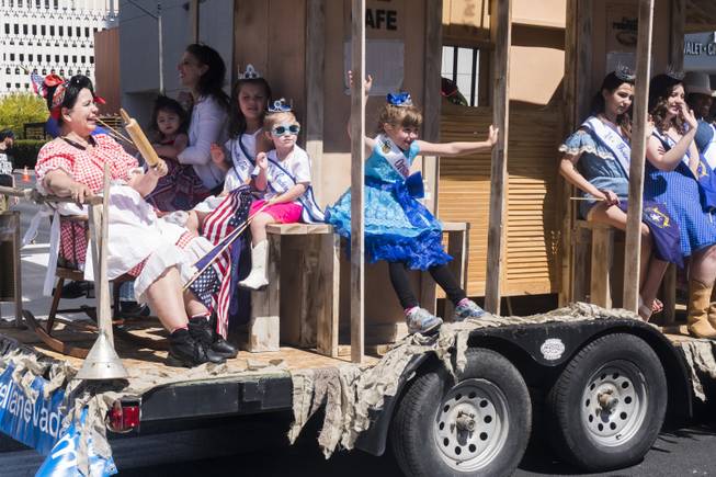 Winners of the Miss Cinderella pageant pass by on their float during the Helldorado parade, Saturday, May 13, 2017.