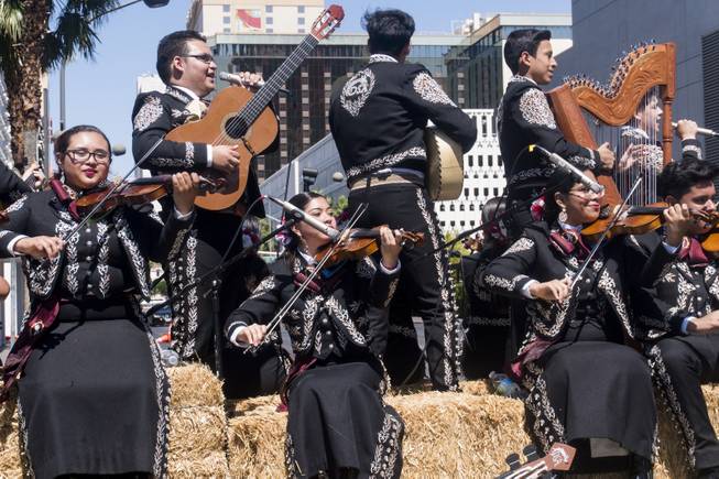 Members of the Del Sol Academy of the Performing Arts Mariachi Encendido Band perform during the Helldorado parade, Saturday, May 13, 2017.