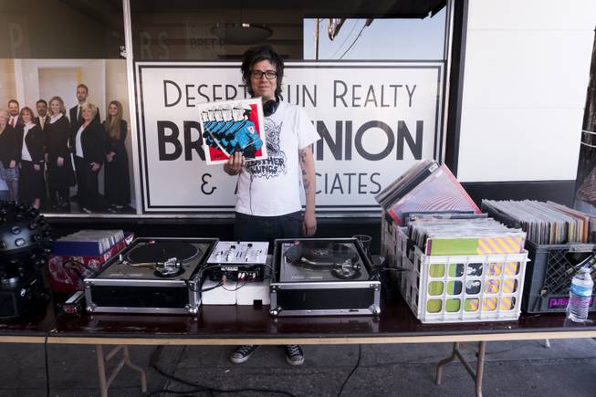 DJ Mike Fish holds up a record from his collection for a photo during the annual Dillinger Block Party in Boulder City, NV, Saturday 13, 2017.