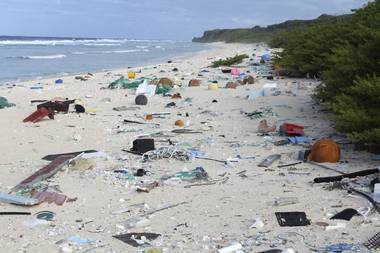 In this 2015 photo provided by Jennifer Lavers, plastic debris is strewn on the beach on Henderson Island. When researchers traveled to the tiny, uninhabited island in the middle of the Pacific Ocean, they were astonished to find an estimated 38 million pieces of trash washed up on the beaches.