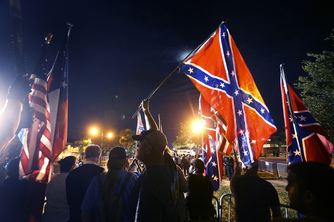 Demonstrators who supports keeping Confederate era monuments protest before the ...