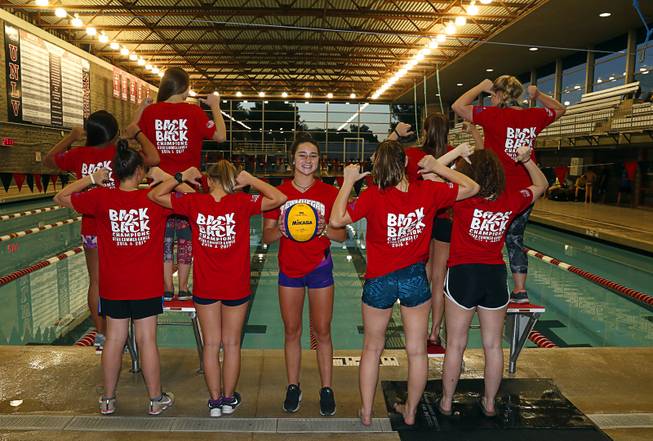 Water polo team members, including Summerly Morton, center, pose before ...