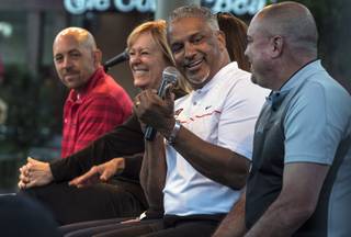 UNLV head basketball coach Marvin Menzies looks to head football coach Tony Sanchez speaks during a question and answer session during the Rebel Summer Fan Fest at The Park at Town Square to kickoff the summer by celebrating the upcoming sport seasons on Thursday, May 19, 2017.
