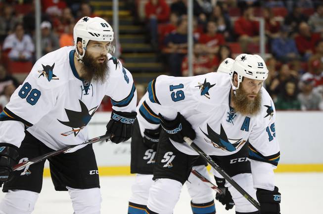 San Jose Sharks defenseman Brent Burns (88) and San Jose Sharks center Joe Thornton (19) wearing early season beards wait for a face-off against Detroit Red Wings in the first period of an NHL hockey game in Detroit, Saturday, Oct. 22, 2016.