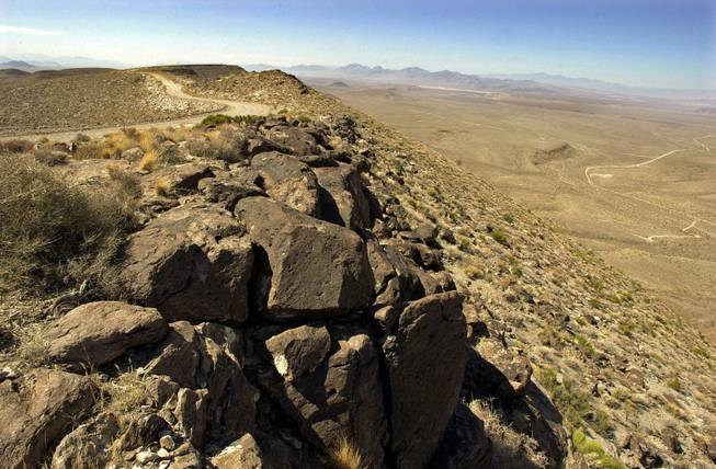 This June 25, 2002, file photo shows the view from the summit ridge of the proposed Yucca Mountain repository site.