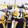 Pittsburgh Penguins defenseman Brian Dumoulin (8) celebrates his goal against the Ottawa Senators with teammates Phil Kessel (81), Evgeni Malkin (71), Ian Cole (28) and Scott Wilson (23) during the second period of Game 4 of the NHL hockey Stanley Cup Eastern Conference finals, Friday, May 19, 2017, in Ottawa, Ontario. 