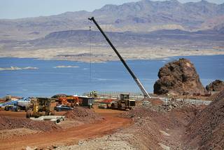 In this May 19, 2017, photo, construction continues on the Southern Nevada portion of U.S. Interstate 11 overlooking Lake Mead near Boulder City, Nev. The planned route for U.S. Interstate 11 will connect Las Vegas with Phoenix.