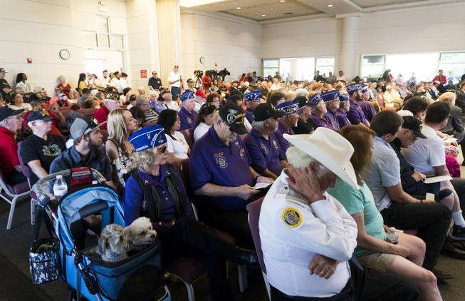 Attendees look on during a musical performance during the Memorial Day Ceremony at the Southern Nevada Veterans Memorial Cemetery in Boulder City, NV, Monday, May 29, 2017.