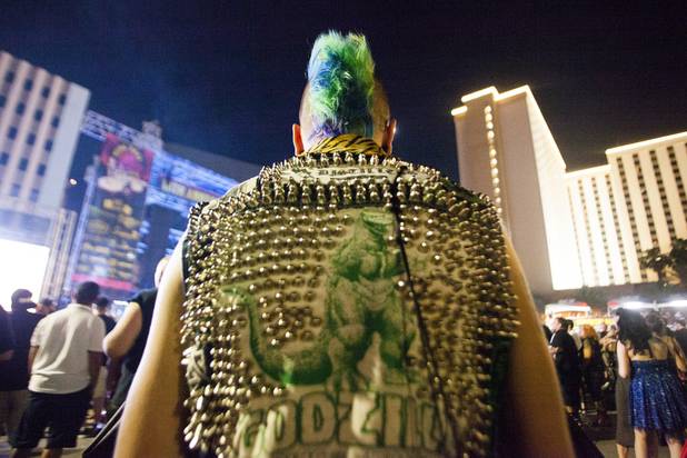 A festival goers with a colorful mohawk and Godzilla vest watches the Cock Sparrer performance during the Punk Rock Bowling Music Festival at the Downtown Events Center in Las Vegas, NV, Monday, May 29, 2017.