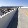 A photographer walks along a new flyover ramp linking the Airport Connector to eastbound 215 before an opening ceremony Monday, June 5, 2017. The new ramp is more than 1/2-mile long and is expected to carry more than 20,000 vehicles per day.